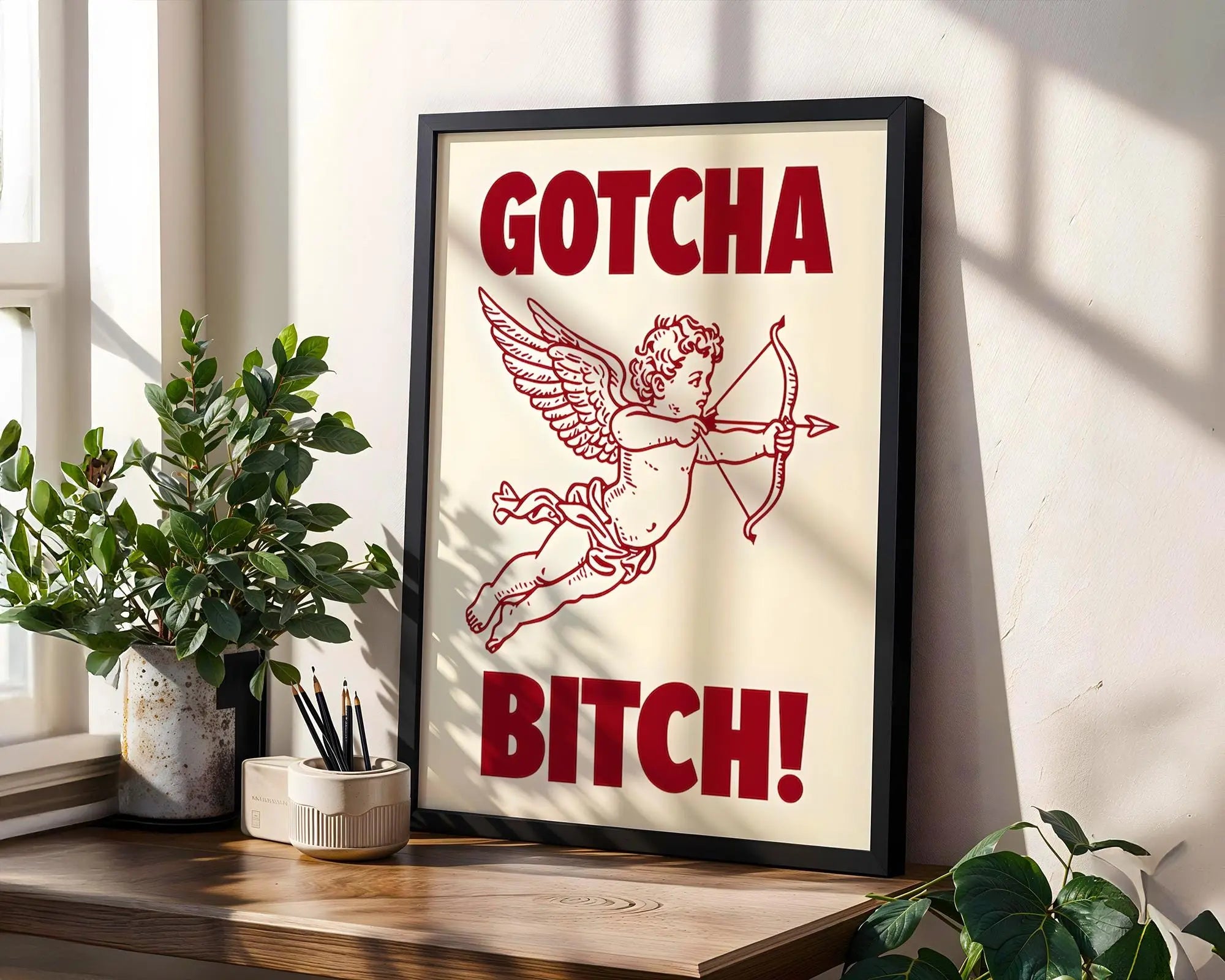 Positive Emotion | Gotcha Bitch Cupid Wall Art | Bold Vintage Illustration | Cheeky Statement Poster wall art print, modern home decor, unframed artwork by Nomad & Nest